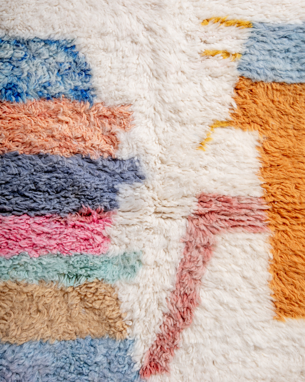 Modern, designer, handcrafted Berber rug from Morocco. Beniourain carpet with beautiful colours and patterns and fluffy wool texture